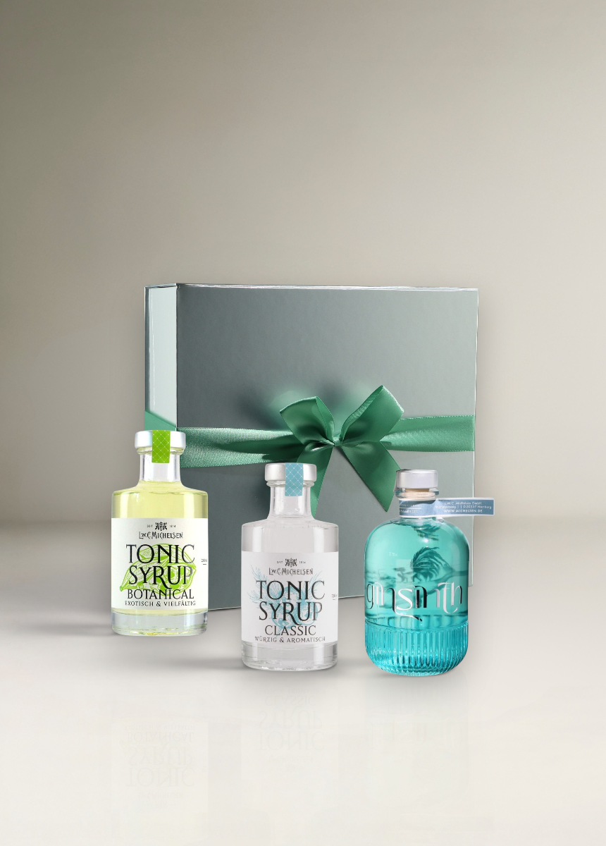 Michelsen Geschenkset mit Tonic Syrup Botanical, Tonic Syrup Classic und Ginsinth Gin in silberner Geschenkbox.