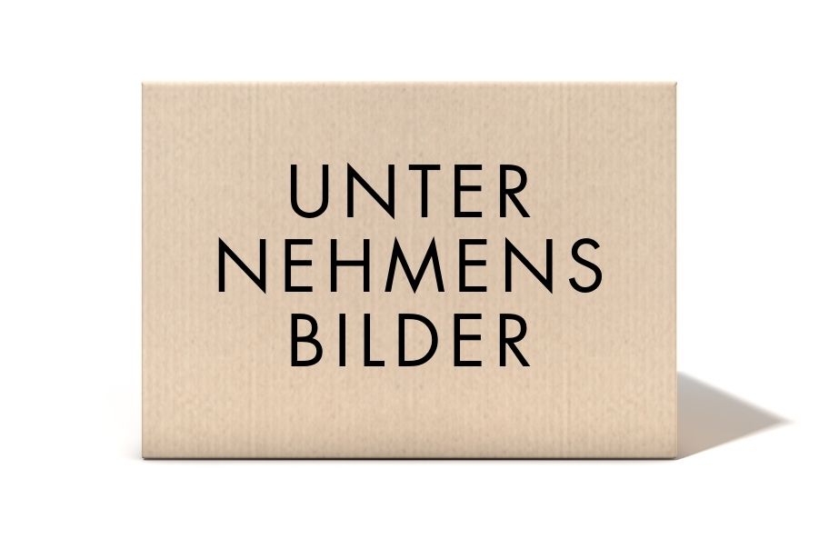 Pappkarton mit der Aufschrift 'UNTERNEHMENSBILDER' auf hellem Hintergrund