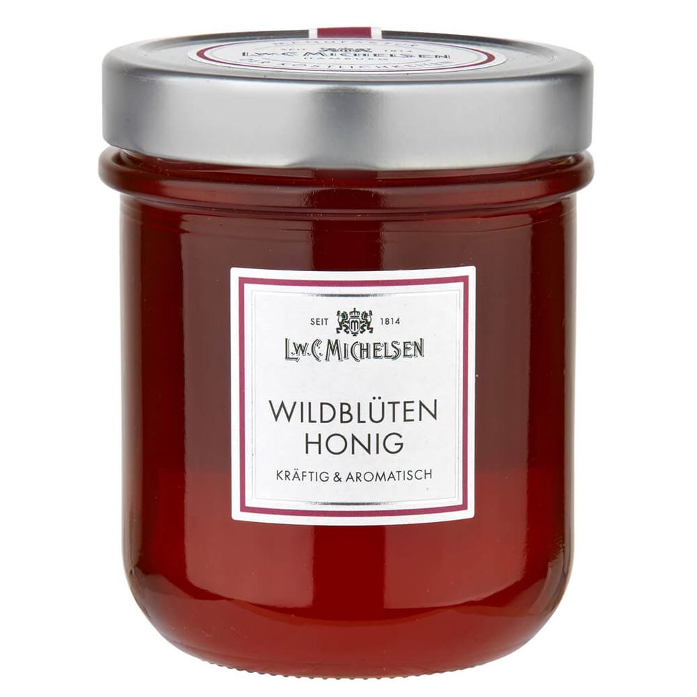 Wildblüten-Honig -Löffelglas- 500g: Tauchen Sie ein in die Welt des L.W.C. Michelsen Wildblüten-Honigs, der seit über 200...