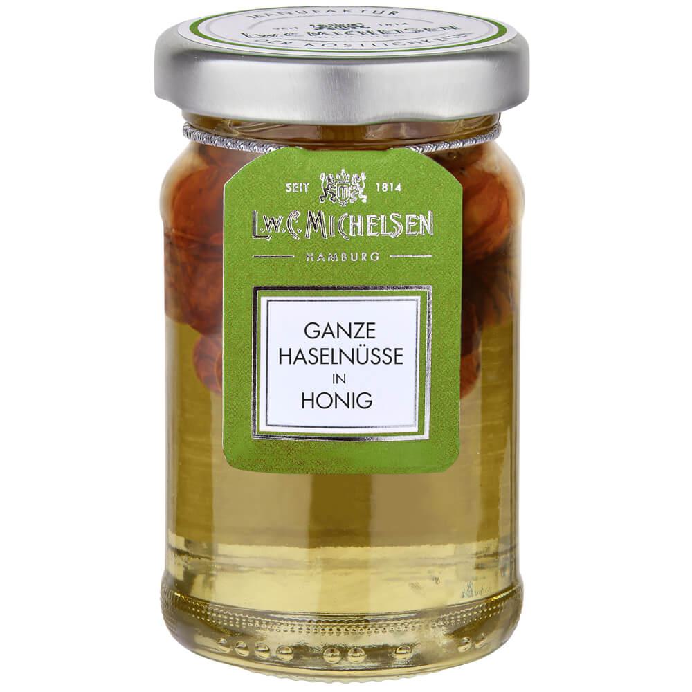 Haselnüsse in Honig -klein-: Unsere Haselnüsse in Honig von L.W.C. Michelsen sind eine wahre Delikatesse, die die Süße des...